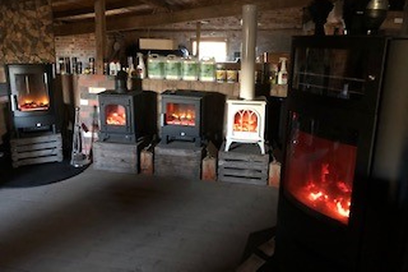 A traditional style electric stove with a glowing flame effect on display in Kent