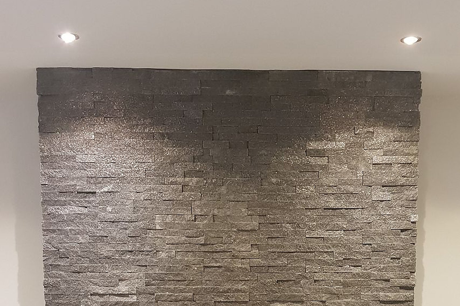 A Stovax Studio 1 inset log burning stove fitted into a plastered chimney breast in Kent