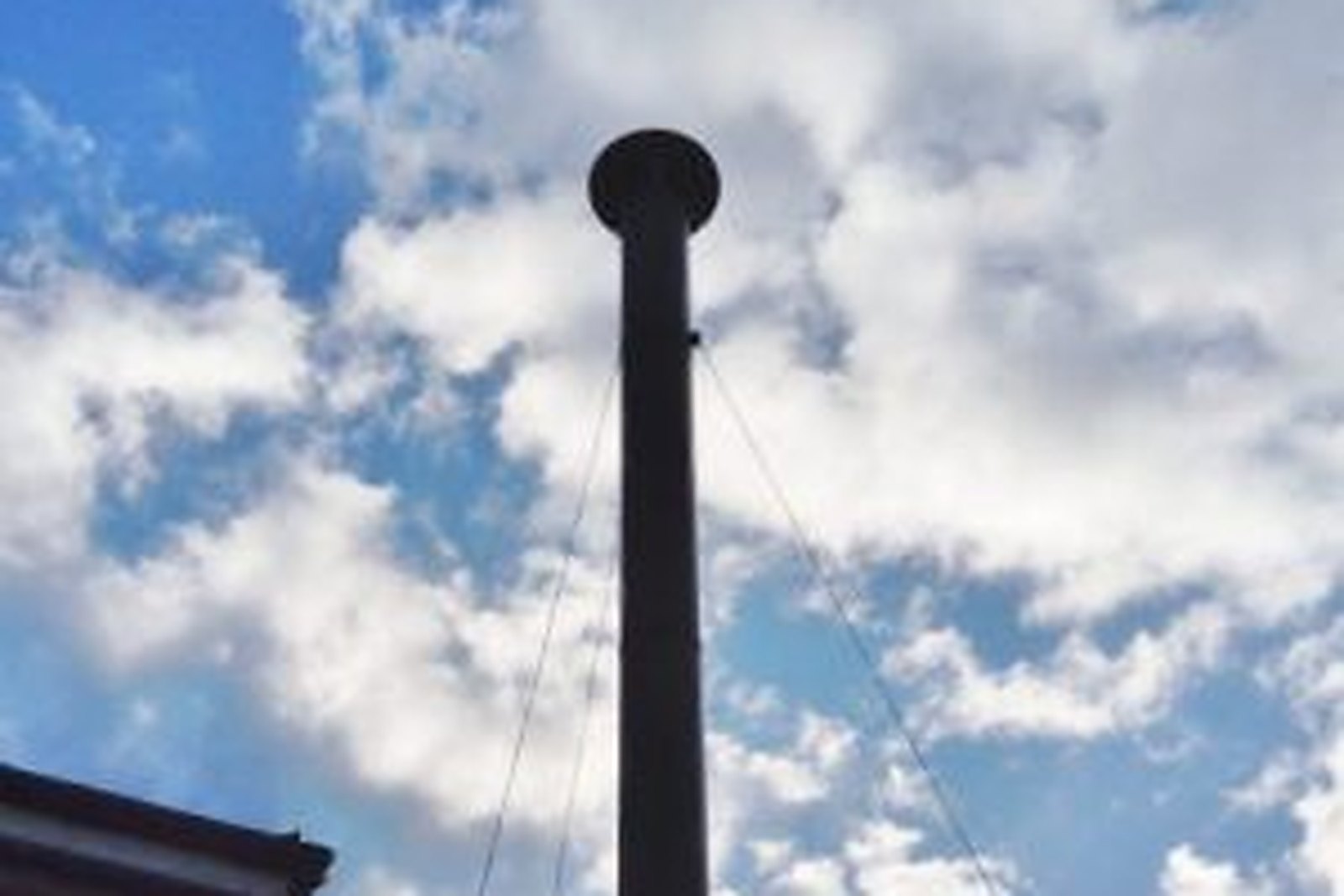 A chimney sweep brush and rods at work on a flue in the Medway towns